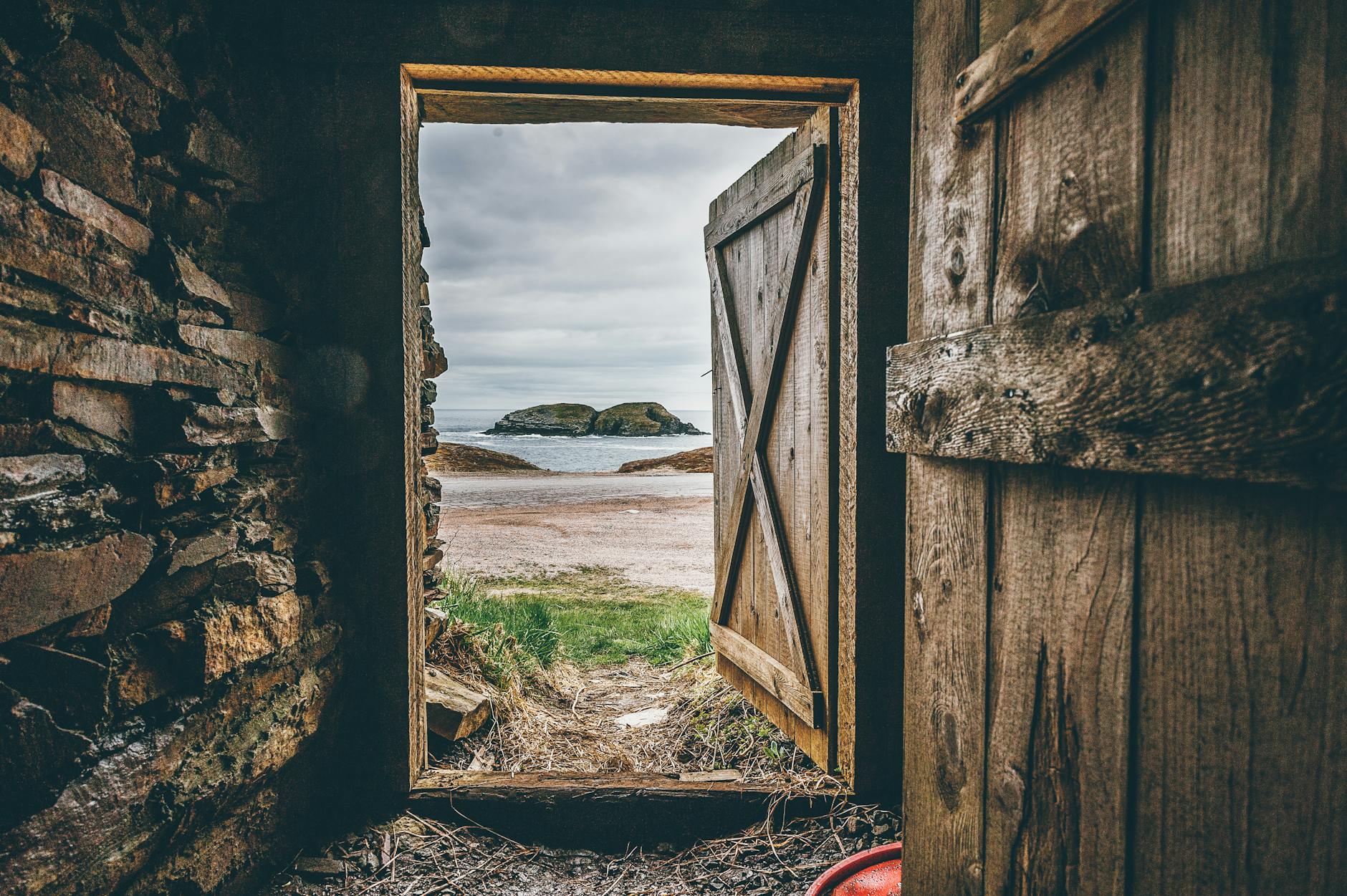 brown wooden opened door shed